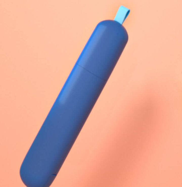 Double-sided electrostatic pet hair remover in blue against a peach background, designed for effective dust and fur removal.