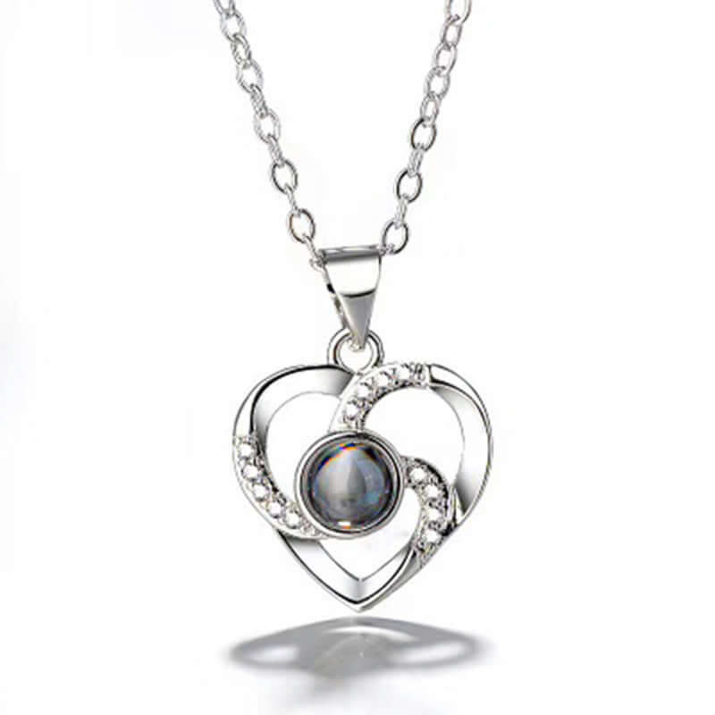 S925 silver heart-shaped necklace with colorful photo projection and sparkling accents.