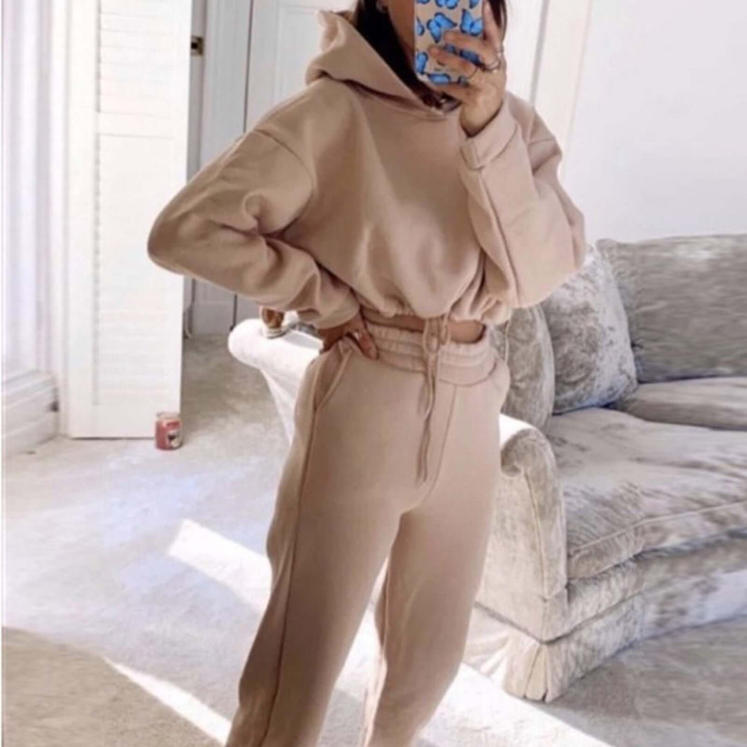 Stylish women's 2-piece casual jogging suit featuring a long sleeve hoodie and comfortable pants in beige.