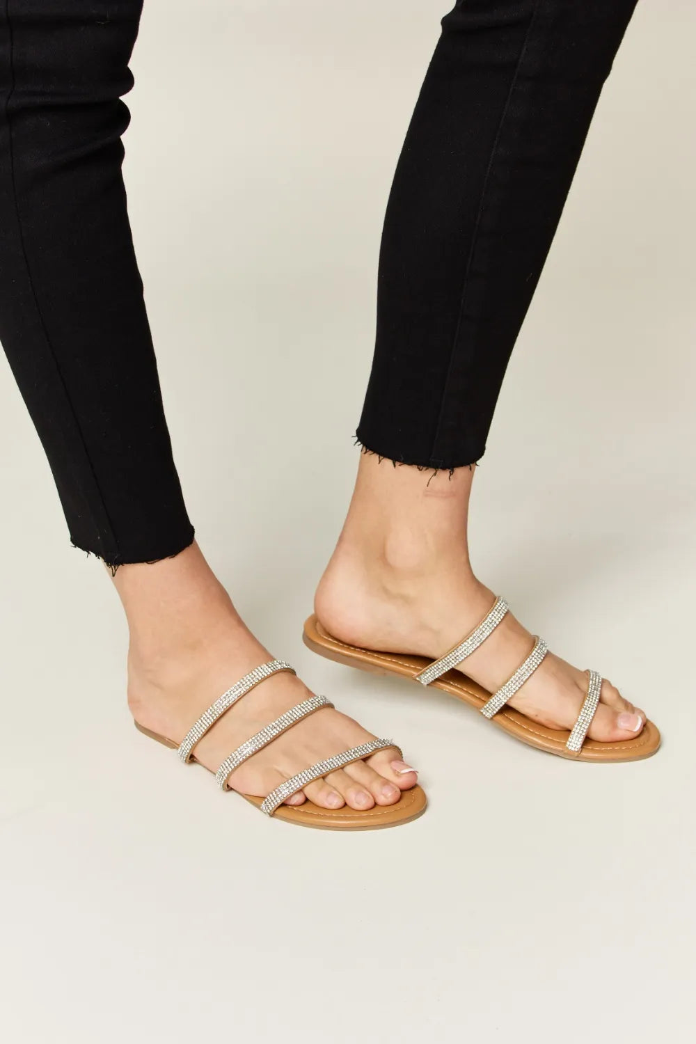 women wearing strappy sandals 