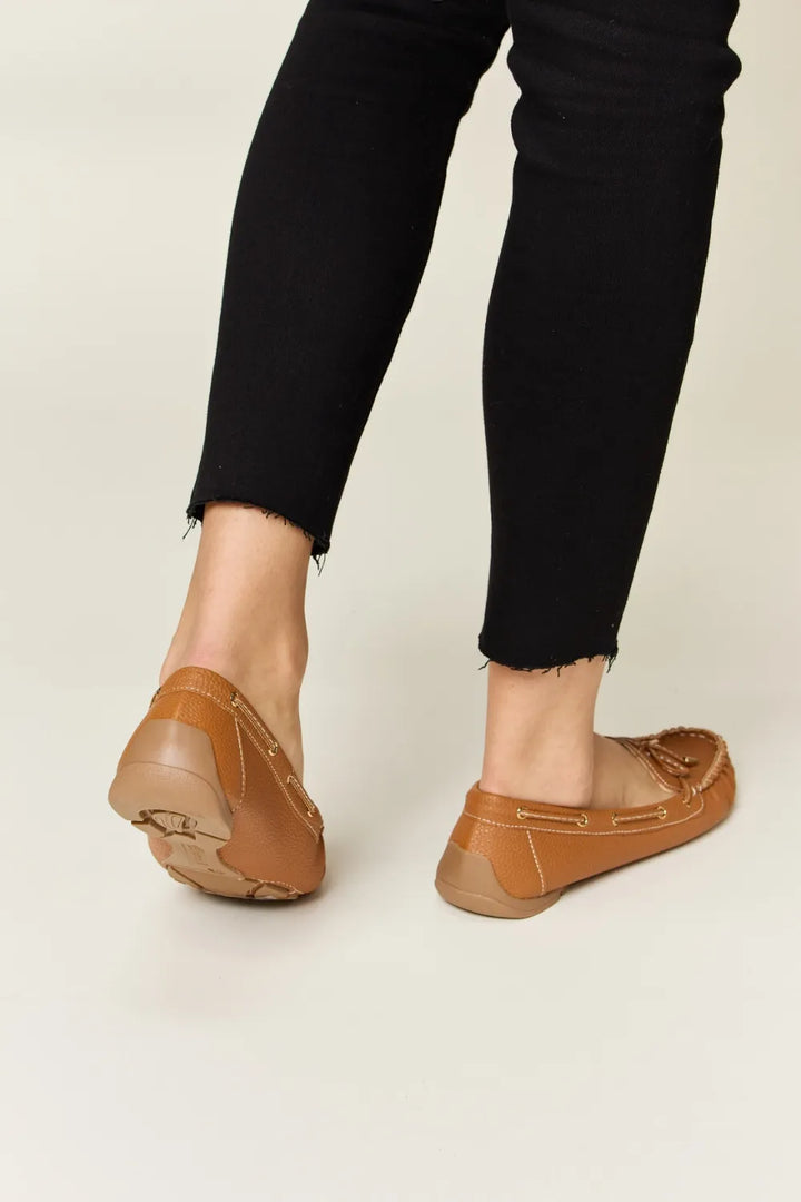 Brown loafers and black pants