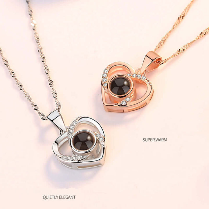 S925 silver and rose gold heart-shaped pendants with black stone, featuring elegant design and sparkling accents.