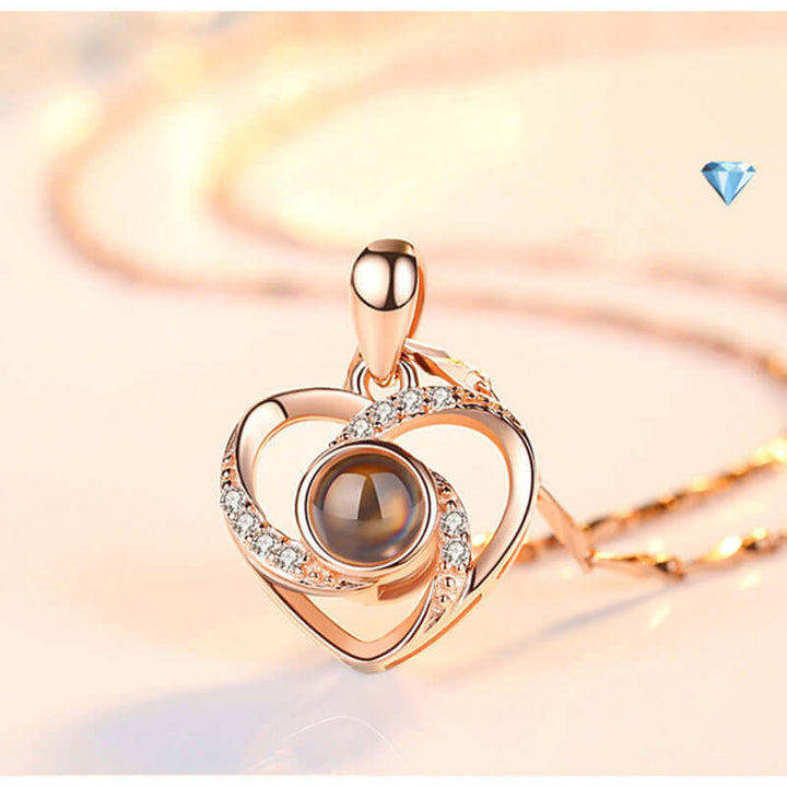 S925 silver heart shaped pendant necklace with colorful photo projection feature and sparkling design.