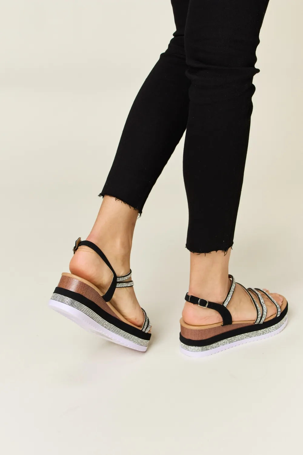 black sandals with white soles