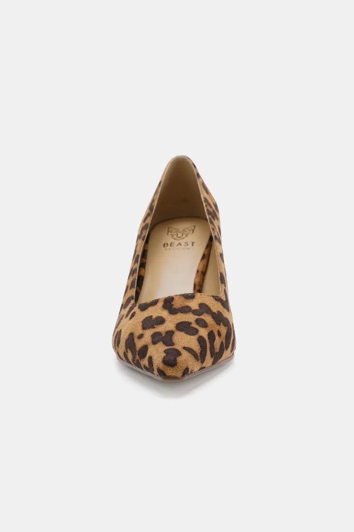 Leopard print high heel shoe on a white background
