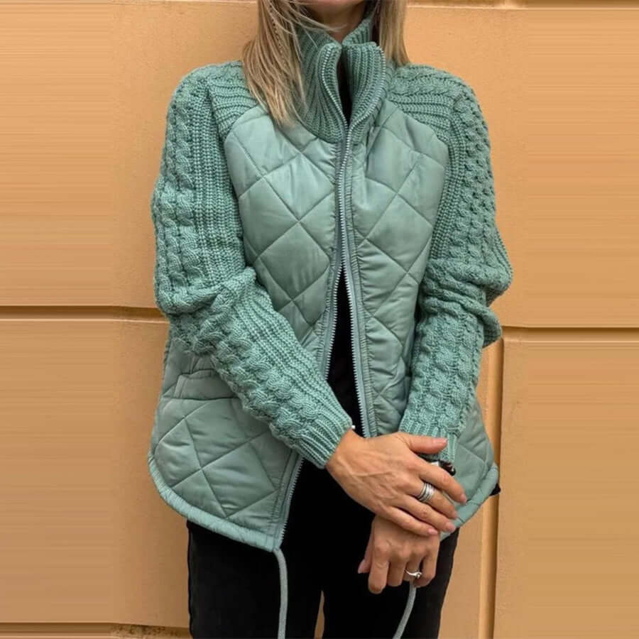 Stylish women's winter jacket in soft blue with knitted stitching and zipper, perfect for cold weather.