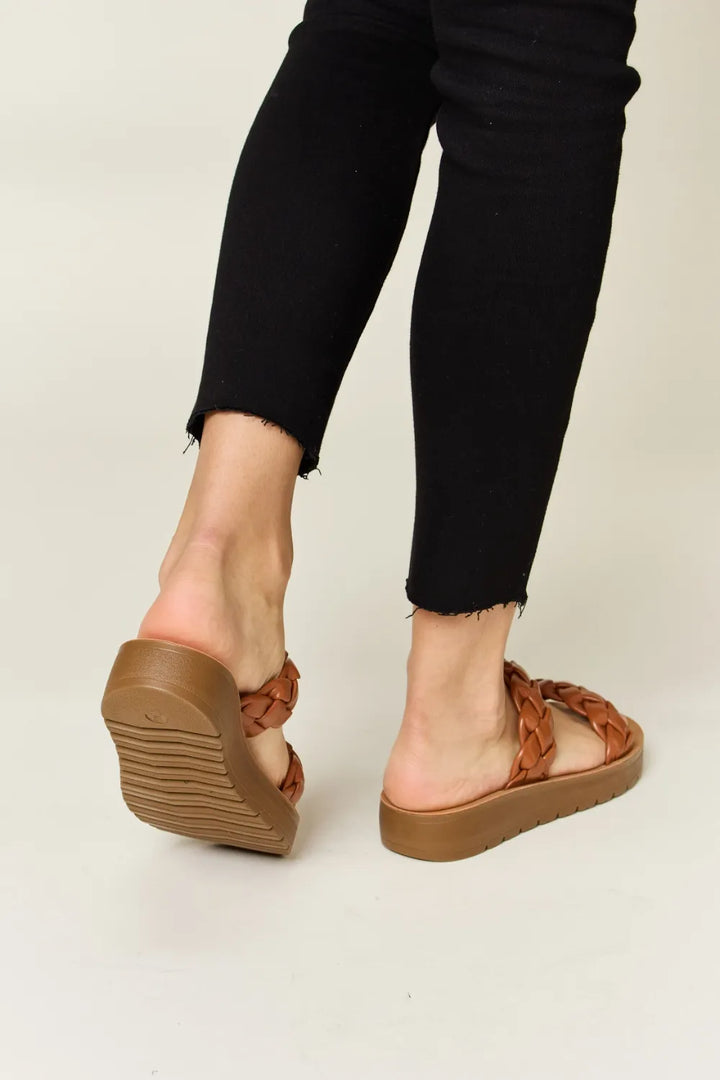 Brown sandals worn