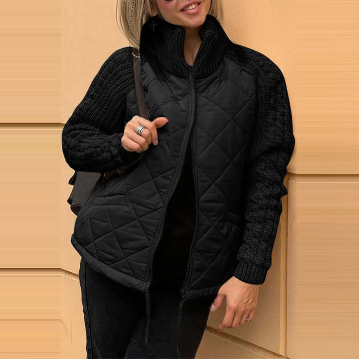 Black stand collar cotton jacket for women with quilted design and knitted sleeves, perfect for winter wear.