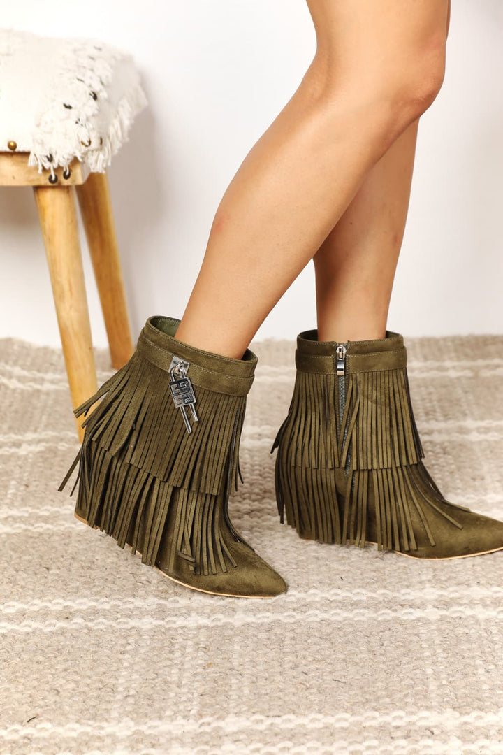 Pair of Green fringe boots
