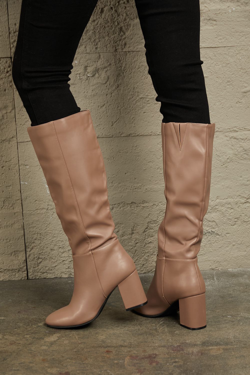Pair of beige knee-high boots